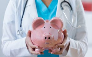 This image about doctor holding saving pig