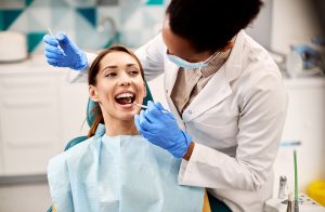 This image is about dentist checking the teeth of patient