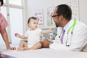Doctor playing with little kid