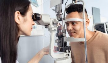 This image about doctor looking at patients eye