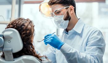 This image is about dentists checking the tooth of patient