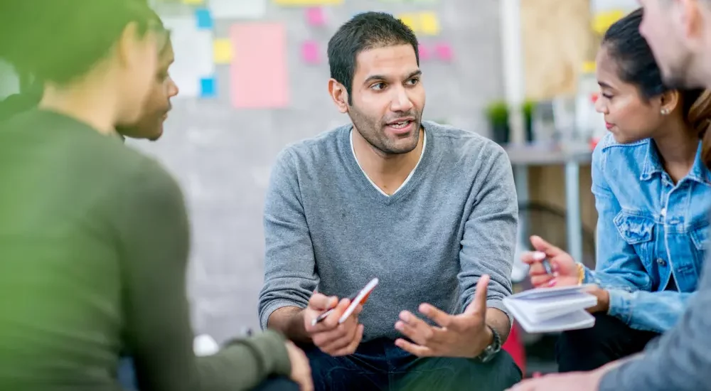 This image about man explaining how to reduce group medical insurance