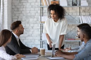 64270b7f9c4339c52f873a05 employee benefits consultant or broker Where to Find Critical Illness and Cancer Insurance for Your Business This image shows people sitting on a chair with a woman explaining them something