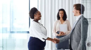 Benefits for Employers How Much Does Critical Illness Insurance Cost for Employees This image is about employee shaking hand