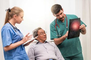 Doctor showing x-ray report to the patient 