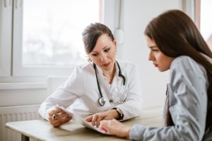 This image about doctor explaining report to the patients 