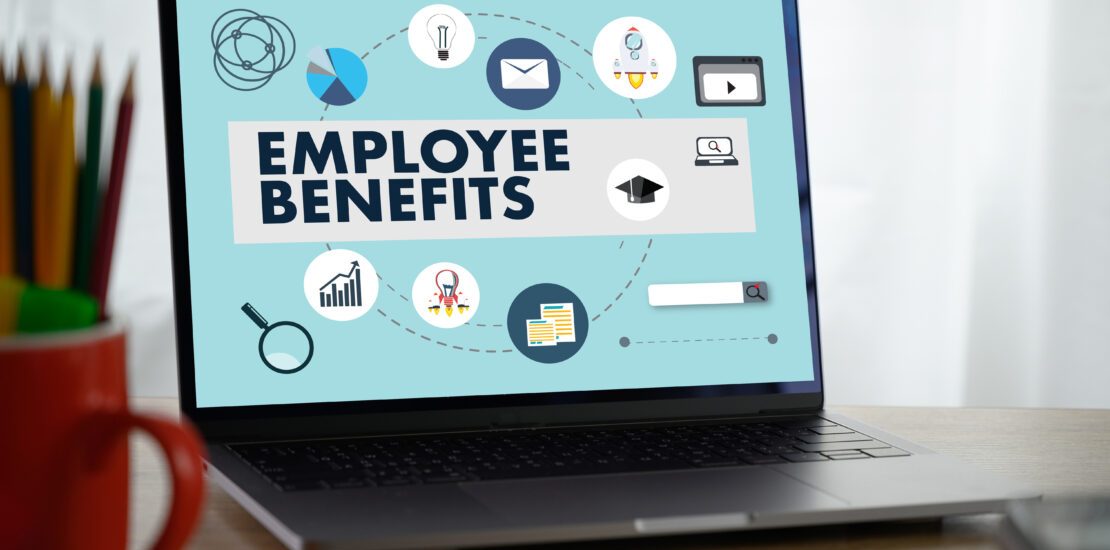 This image is about laptop on desk. showing employee benefits