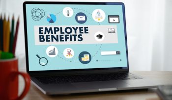 This image is about laptop on desk. showing employee benefits