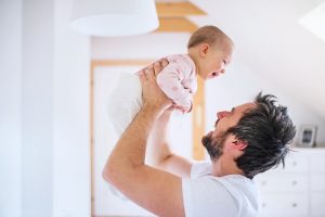 A father holding his baby