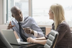 487704665 Jose Luis Pelaez Inc BlendImages GettyImages 56a46e785f9b58b7d0d6f649 What Is an EPO Plan? The Complete Guide to Exclusive Provider Organizations man and women talking in the office